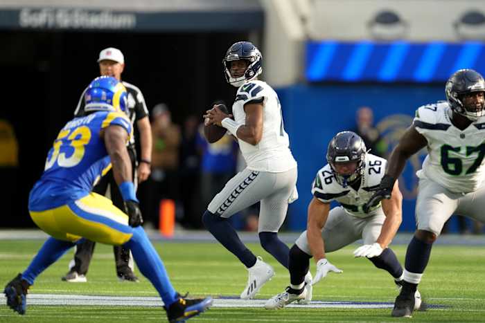 Seattle Seahawks quarterback Geno Smith (7) looks to pass against the Los Angeles Rams in the first quarter at SoFi Stadium.